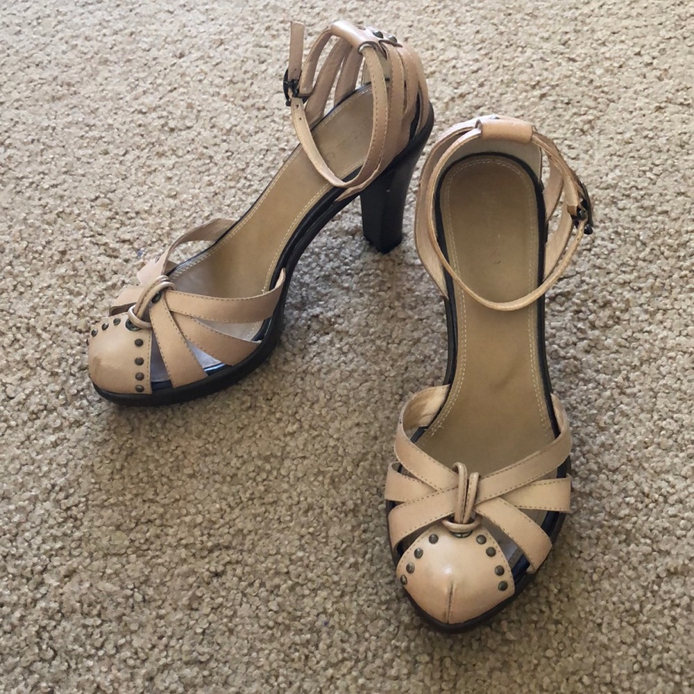 Brass studs decorated heels with platform